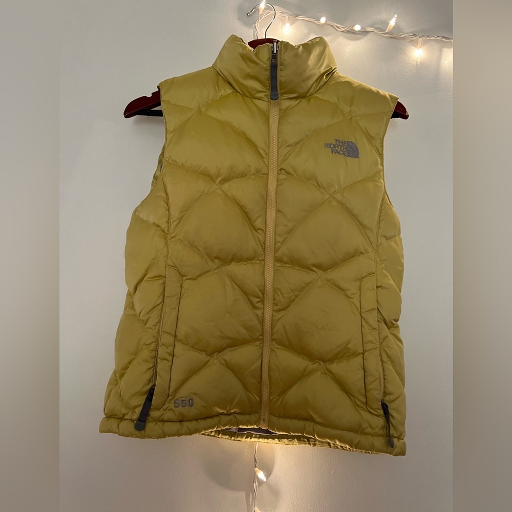 The North Face yellow puffer vest